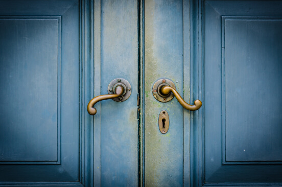 Blue vintage door with golden door handle