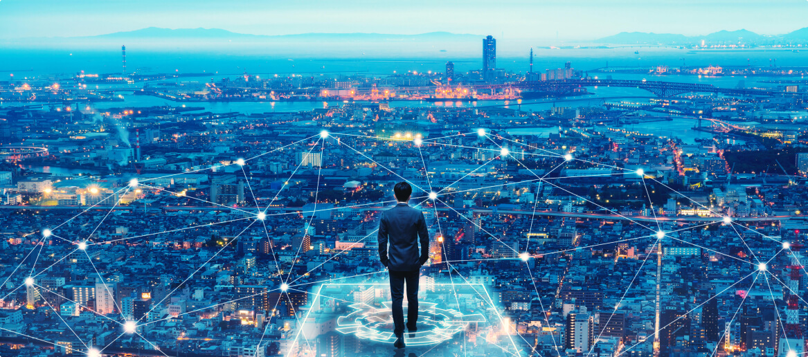 Man standing in front of a digital cityscape
